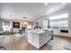Open-concept kitchen with a large island, modern appliances, and seamless integration with the dining area at 8738 W Runion Dr, Peoria, AZ 85382