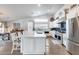 Spacious kitchen featuring a central island, stainless appliances, and abundant natural light at 8738 W Runion Dr, Peoria, AZ 85382