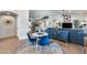 Comfortable and open living area with modern furniture and stylish decor for a relaxing atmosphere at 8738 W Runion Dr, Peoria, AZ 85382