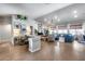 Bright living room with hardwood floors, a vaulted ceiling, and stylish blue sofa at 8738 W Runion Dr, Peoria, AZ 85382