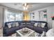 Inviting living room features a plush sectional sofa, stylish decor, and a bright, airy atmosphere at 8738 W Runion Dr, Peoria, AZ 85382