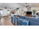Open-concept living room featuring hardwood floors, and views of the home office at 8738 W Runion Dr, Peoria, AZ 85382