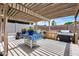 Covered patio with a built-in grill, perfect for outdoor entertaining and shaded gatherings at 8738 W Runion Dr, Peoria, AZ 85382