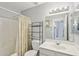 Cozy bathroom featuring shower/tub combination and white vanity with ample lighting at 10521 W Ross Ave, Peoria, AZ 85382