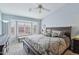 Spacious primary bedroom features a large bed, bay windows, and plush carpeting at 10521 W Ross Ave, Peoria, AZ 85382