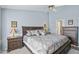 Spacious primary bedroom with a ceiling fan, carpet floors, and neutral wall paint at 10521 W Ross Ave, Peoria, AZ 85382