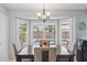 Comfortable dining room with a beautiful bay window overlooking the backyard pool at 10521 W Ross Ave, Peoria, AZ 85382