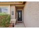 Inviting front entrance featuring a decorative door, manicured shrubbery, and welcoming accents at 10521 W Ross Ave, Peoria, AZ 85382