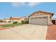 Charming single-Gathering home featuring a spacious driveway, manicured lawn, and inviting curb appeal at 10521 W Ross Ave, Peoria, AZ 85382