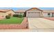 Single-story home with a two-car garage, low maintenance yard, and desert landscaping at 10521 W Ross Ave, Peoria, AZ 85382