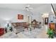Spacious living room with high ceilings, modern lighting, comfortable seating, and tile floors at 10521 W Ross Ave, Peoria, AZ 85382