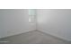 Bright, spacious bedroom features soft gray carpet, white walls and bright natural light at 1057 S 151St Ln, Goodyear, AZ 85338