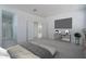 Staged bedroom with carpeting, closet, ensuite bathroom, television and furniture at 1057 S 151St Ln, Goodyear, AZ 85338