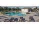 Resort-style community pool area with comfortable lounge chairs and a nearby pool house for relaxation and enjoyment at 1057 S 151St Ln, Goodyear, AZ 85338