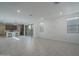 Bright, open-concept living room featuring tile flooring, recessed lighting, and abundant natural light at 1057 S 151St Ln, Goodyear, AZ 85338