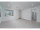 Bright, open living room with tile flooring, recessed lighting, and modern neutral finishes at 1057 S 151St Ln, Goodyear, AZ 85338
