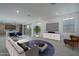 Stylishly furnished living room with modern decor, an open layout, and abundant natural light at 1057 S 151St Ln, Goodyear, AZ 85338