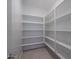 Walk-in pantry with tiled floors and shelving at 1057 S 151St Ln, Goodyear, AZ 85338