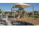Gathering-friendly playground with a variety of play structures and shaded seating areas, perfect for community gatherings at 1057 S 151St Ln, Goodyear, AZ 85338