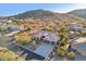 Scenic aerial view of a single-Gathering home nestled in a desert mountain community at 11255 S San Adrian Ln, Goodyear, AZ 85338