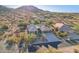 Beautiful aerial view of a home in the desert, and scenic desert landscaping at 11255 S San Adrian Ln, Goodyear, AZ 85338