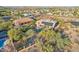 An aerial view of a community showcasing a backyard pool, solar panels, and desert landscaping at 11255 S San Adrian Ln, Goodyear, AZ 85338