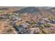 Picturesque aerial view of homes in a desert community with mature landscaping at 11255 S San Adrian Ln, Goodyear, AZ 85338