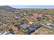 Desert community view showcasing homes nestled among natural landscapes with mountain backdrop at 11255 S San Adrian Ln, Goodyear, AZ 85338