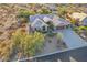Aerial view of house showing tile roof, desert landscaping, and long concrete driveway at 11255 S San Adrian Ln, Goodyear, AZ 85338
