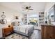 Bedroom featuring a decorative ceiling fan, a window seat and rustic decor and carpet floors at 11255 S San Adrian Ln, Goodyear, AZ 85338