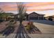 Charming single-story home with a three-car garage and desert-friendly landscaping at 11255 S San Adrian Ln, Goodyear, AZ 85338