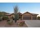 Charming single-story home featuring a tile roof, desert landscaping, and a spacious three-car garage at 11255 S San Adrian Ln, Goodyear, AZ 85338