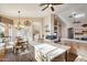 Bright and airy kitchen with a center island and a breakfast nook, offering backyard views at 11255 S San Adrian Ln, Goodyear, AZ 85338