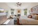 Inviting main bedroom featuring a cozy fireplace, patterned accents and a spacious layout at 11255 S San Adrian Ln, Goodyear, AZ 85338