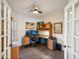 Dedicated home office with built-in desk, storage, and natural light at 11255 S San Adrian Ln, Goodyear, AZ 85338