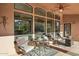 Covered patio with mountain views and comfortable seating for relaxation at 11255 S San Adrian Ln, Goodyear, AZ 85338