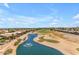 Stunning aerial view of a neighborhood featuring a scenic pond and golf course at 1173 E Daisy Way, San Tan Valley, AZ 85143