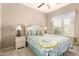 Cozy bedroom featuring a window, carpet floors, ceiling fan, and ample natural light at 1173 E Daisy Way, San Tan Valley, AZ 85143