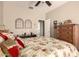 Comfortable bedroom featuring a desk, carpet floors, ceiling fan, and plenty of natural light at 1173 E Daisy Way, San Tan Valley, AZ 85143