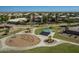 Well-maintained neighborhood park with walking paths, playground, picnic shelter, and mature trees at 1173 E Daisy Way, San Tan Valley, AZ 85143
