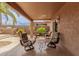Inviting covered patio with comfortable seating area, perfect for outdoor relaxation and gatherings at 1173 E Daisy Way, San Tan Valley, AZ 85143
