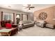 Comfortable living room with neutral carpet, decorative wall accents, and coordinated furniture at 1173 E Daisy Way, San Tan Valley, AZ 85143