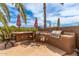Outdoor kitchen featuring a built-in grill, tile counter, and bar seating on a stone-paved patio at 1173 E Daisy Way, San Tan Valley, AZ 85143