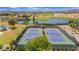 Gorgeous aerial view showcasing well-maintained tennis courts in a picturesque community at 1173 E Daisy Way, San Tan Valley, AZ 85143
