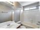 Bright bathroom features a shower-tub combo, and a large vanity at 12233 W Aster Dr, El Mirage, AZ 85335