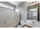 Bathroom featuring a combination tub and shower, a single sink vanity, and neutral paint at 12233 W Aster Dr, El Mirage, AZ 85335