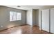 Bedroom features wood floors, a window, and a closet with sliding doors at 12233 W Aster Dr, El Mirage, AZ 85335