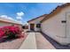 Home entrance complemented by lovely desert landscaping and an inviting doorway at 12233 W Aster Dr, El Mirage, AZ 85335