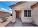 Home entrance complemented by lovely desert landscaping and an inviting doorway at 12233 W Aster Dr, El Mirage, AZ 85335