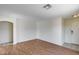 Spacious living room with laminate flooring and recessed lighting, great for entertaining guests at 12233 W Aster Dr, El Mirage, AZ 85335